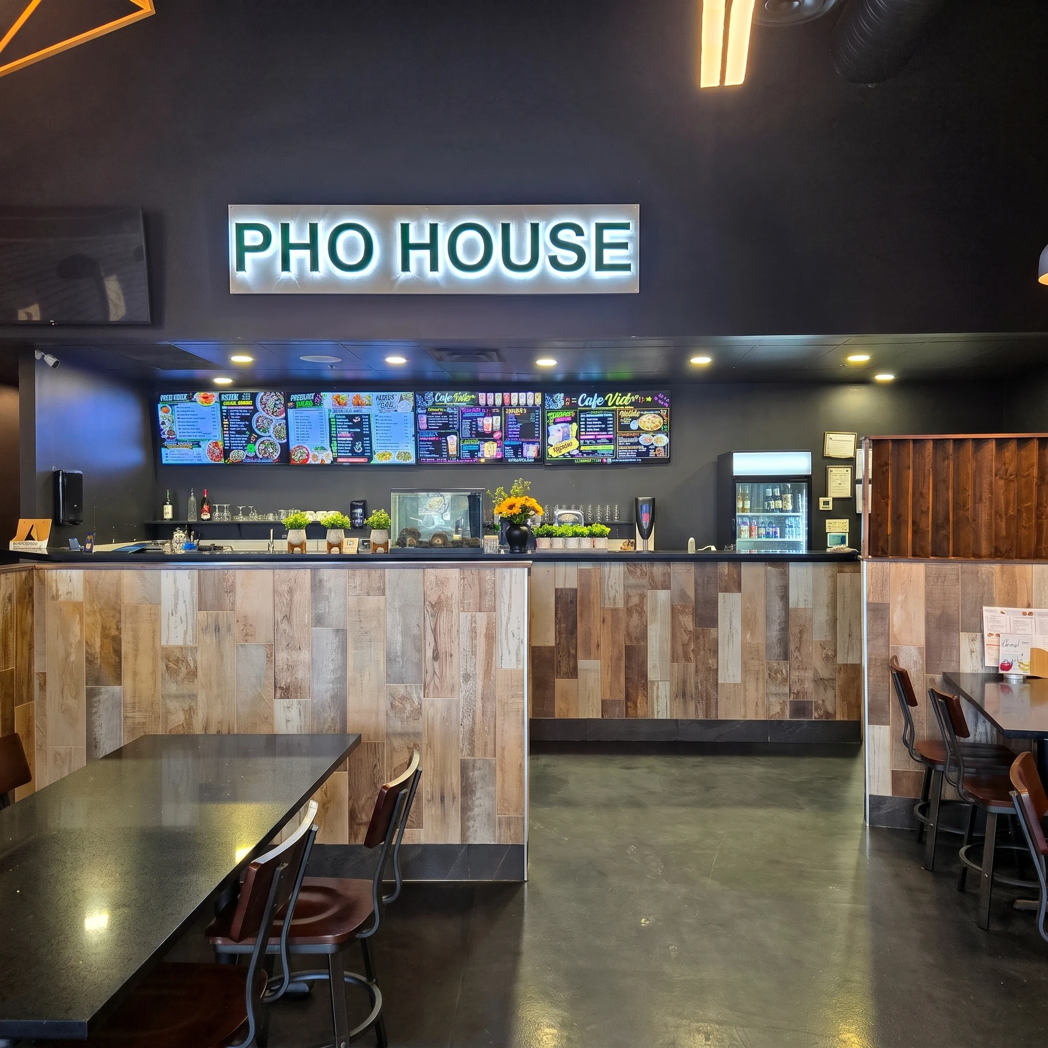 Bowl of beef pho with spring rolls, bean sprouts and lime at Pho House Chappelle