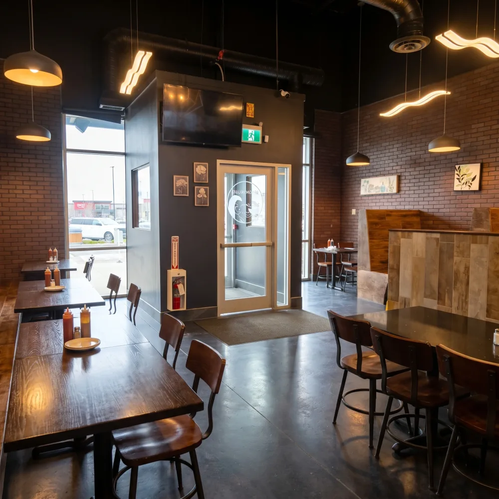 Dining room with the Pho House and Cafe Viet signs