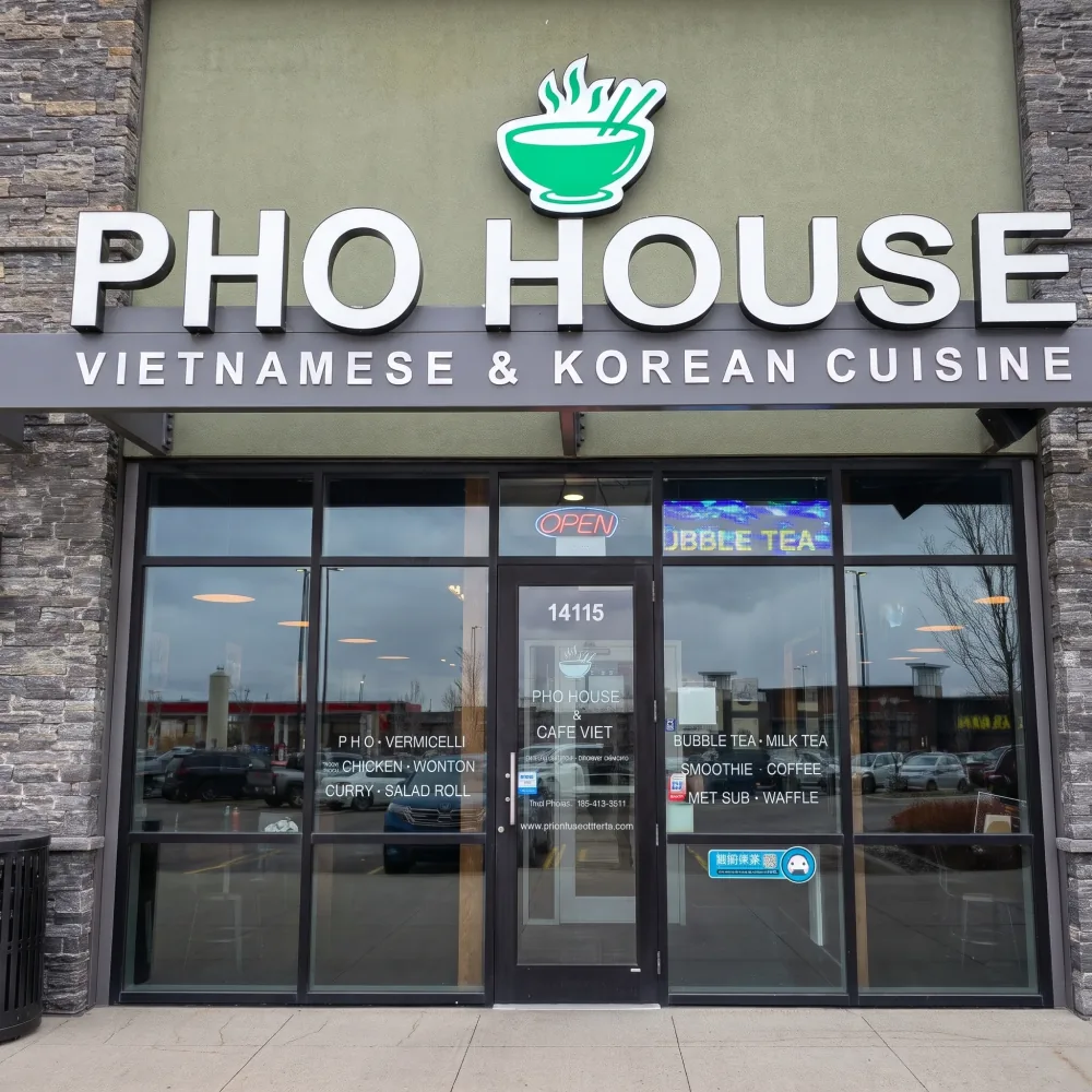 Pho House storefront with Vietnamese & Korean Cuisine sign on 28 Ave SW